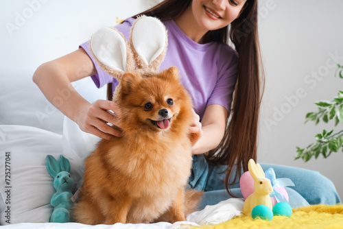 Young woman putting bunny e...