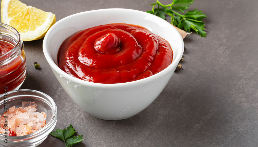 Delicious ketchup tasty sauce in white bowl and ingredients; space for text Delicious ketchup tasty sauce in white bowl and ingredients; space for text