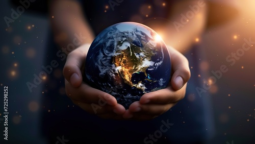 Hands holding the Earth against a space backdrop. The concept of planetary care.