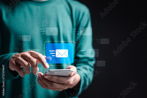 Marketing or newsletter concept, Person use smartphone with virtual Email icons for Send bulk documents via email. Direct selling projects in business List of customers who want to send by email. photo