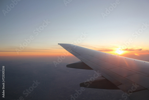 Wing of an airplane in the sunset