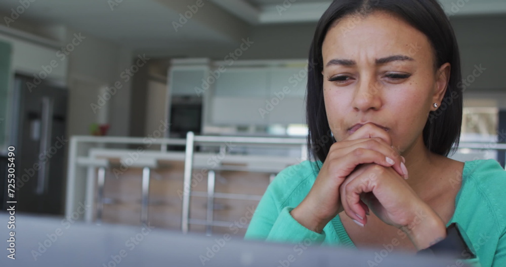 Image of 6g texts over biracial woman using laptop Image of 6g texts over biracial woman using laptop