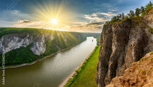 Majestic River Flowing Alongside Towering Cliffs with Earthy Texture, Scenic Background. Wide Landscape with the Sun Setting on the Horizon