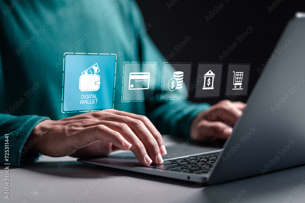© Pakin - Digital wallet or E wallet concept. Person use laptop with virtual digital wallet icon for online payment. Mobile banking, online finance, e-commerce. Digital economy used for web and mobile.