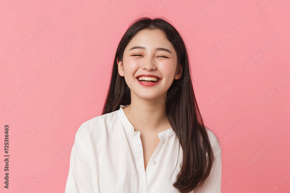 beautiful young asian woman smiling lively standing in pink isolated studio background beautiful young asian woman smiling lively standing in pink isolated studio background