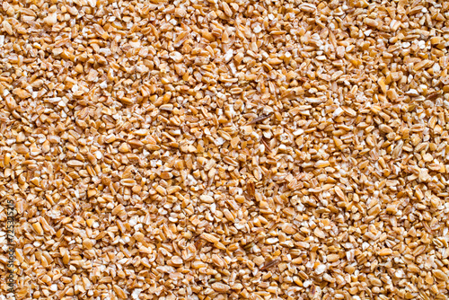 Texture of wheat groats top view. Natural wheat groats.