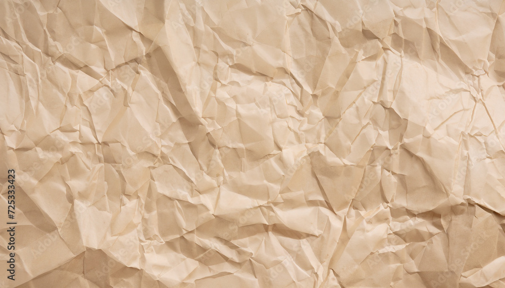 Obraz premium crumpled cream paper background texture from above, brown color abstraction