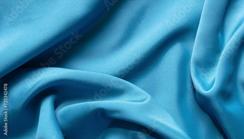 Abstract cyan blue sapphire color fabric texture background. beautiful design with wavy folds