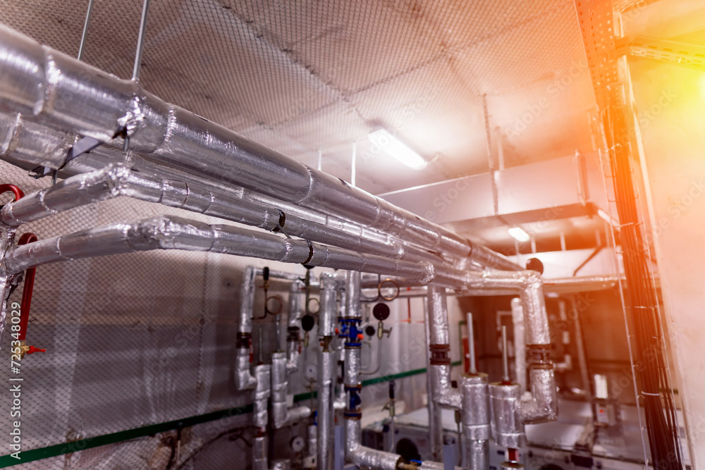 Interior industrial gas boiler with a lot of piping, pumps and valves Interior industrial gas boiler with a lot of piping, pumps and valves