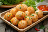 A mouthwatering dish featuring golden-brown fried fish balls