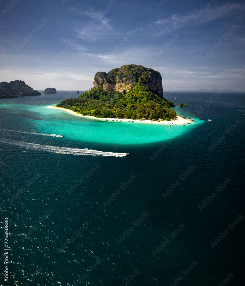 A breathtaking aerial view captures the pristine beauty of Krabi's enchanting island, adorned with turquoise waters and lush greenery