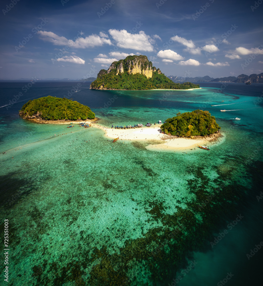 A breathtaking aerial view captures the pristine beauty of Krabi's enchanting island, adorned with turquoise waters and lush greenery