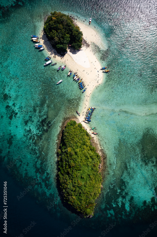 A breathtaking aerial view captures the pristine beauty of Krabi's enchanting island, adorned with turquoise waters and lush greenery