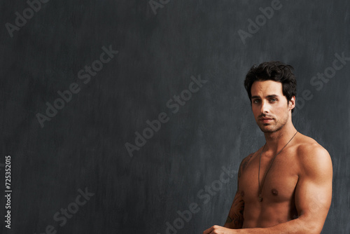 Portrait, fitness model and man shirtless, strong and muscular results from strength training, body building and workout. Bodybuilder, chalkboard mockup space and studio person on black background