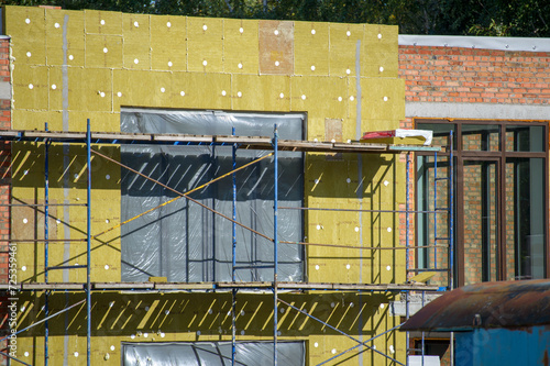 view of construction doing insulation of wall at construction site
