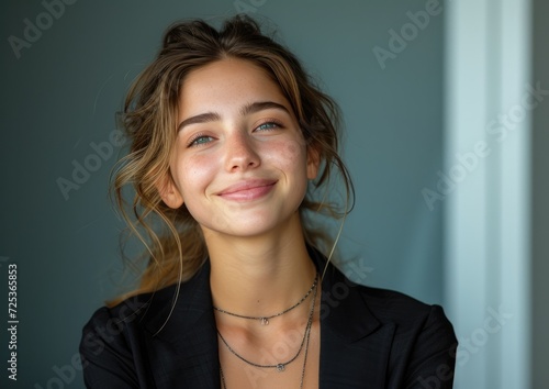 businesswoman, happy smiling female, wearing suit, light clean background