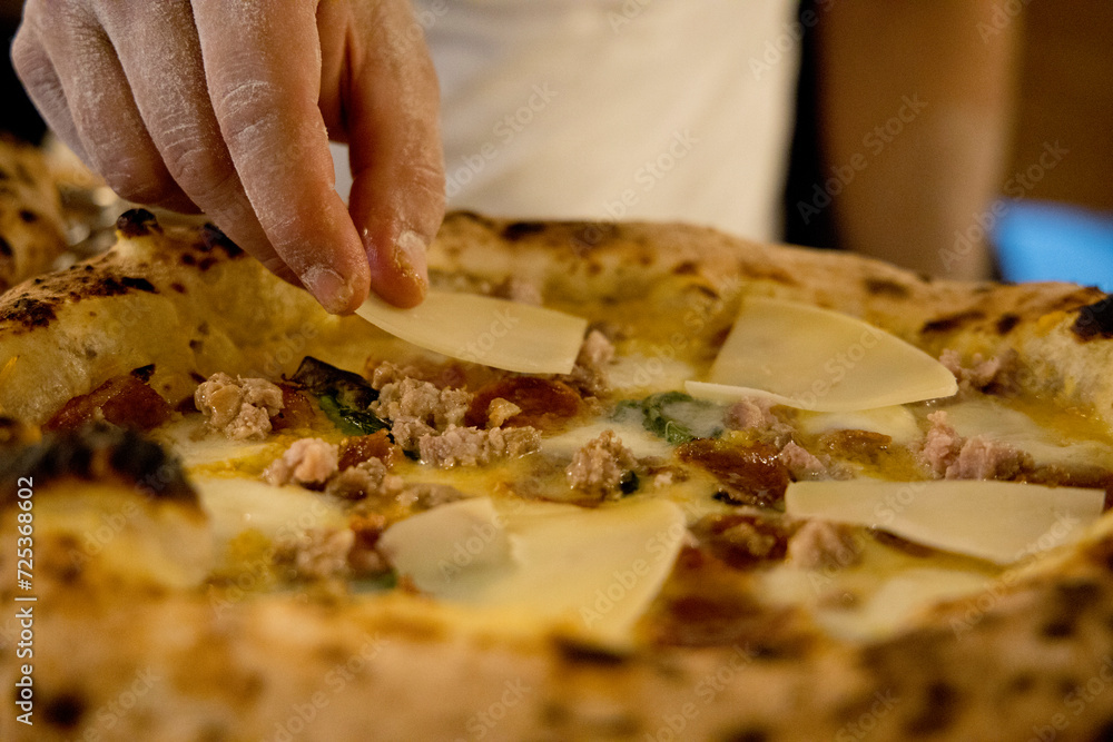 Experience street food by tasting freshly baked pizza made in Naples in multiple flavors and various types