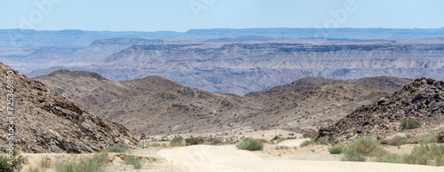 downhill gravel road with Canyon in background, near Hobas,  Namibia photo