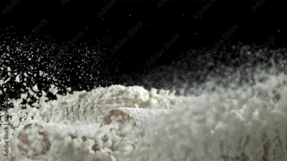 The rolling pin falls into the flour. Filmed on a high-speed camera at 1000 fps. High quality FullHD footage The rolling pin falls into the flour. Filmed on a high-speed camera at 1000 fps. High quality FullHD footage