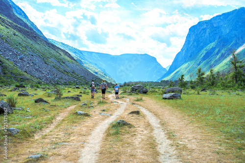 people hiking in the valley