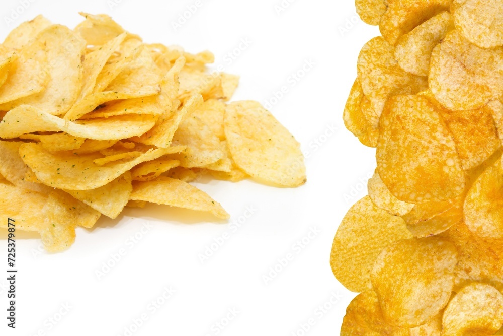 Close-up of salty potatoes chip on white background
