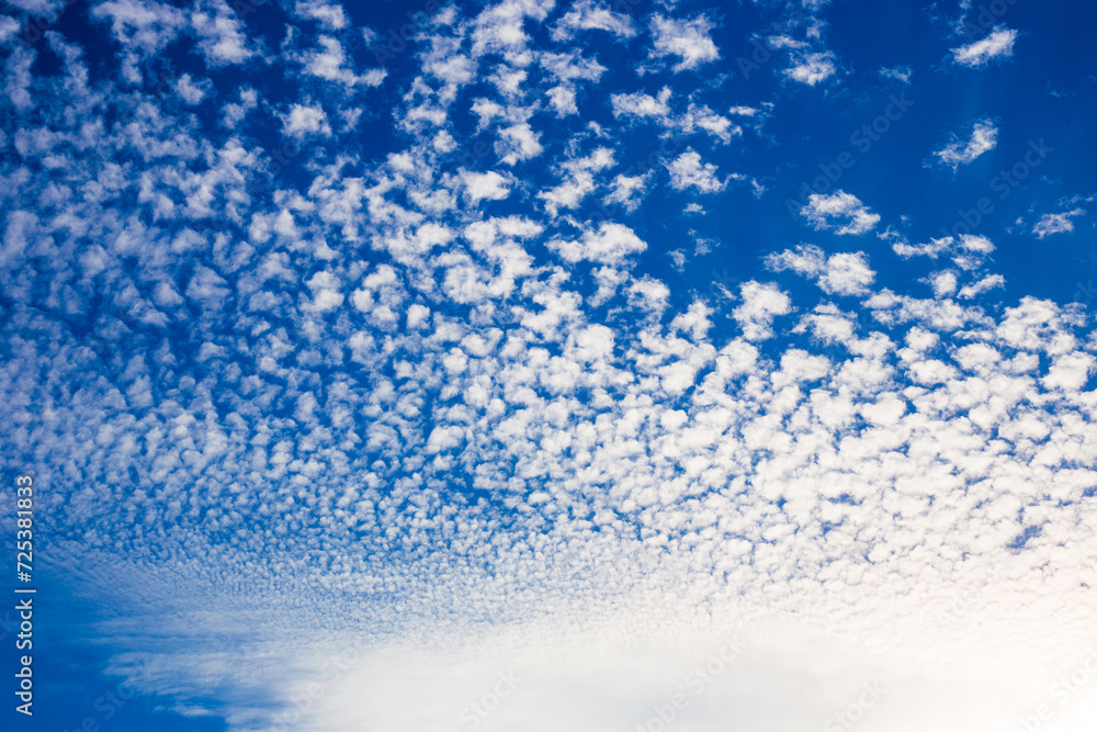 blue sky and pieces of fluffy white clouds in the background blue sky and pieces of fluffy white clouds in the background