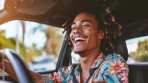 A man with dreadlocks is smiling while driving a car, finding happiness, captured in a car commercial photograph. photo
