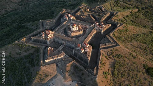 Drone footage over the Fortress of Nossa Senhora da Graca at sunrise in Elvas, Portugal photo