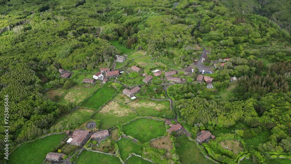 Drone shot of landscape scene of Aldeia da Cuada in Flores island in Azores archipelago at sunset Drone shot of landscape scene of Aldeia da Cuada in Flores island in Azores archipelago at sunset