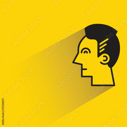 man face with shadow on yellow background