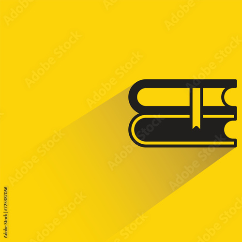 book icon with shadow on yellow background