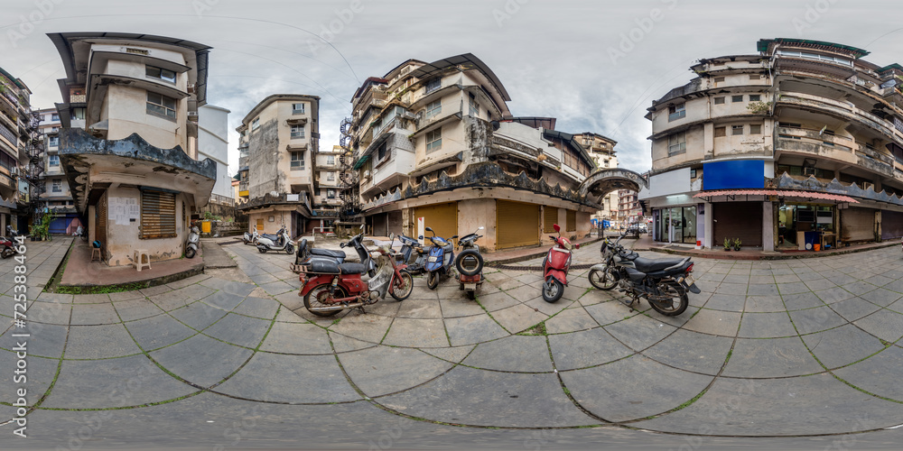 full seamless spherical hdr 360 panorama inside old houses in narrow courtyard or backyard of city bystreet with bike parking in an indian town in equirectangular projection