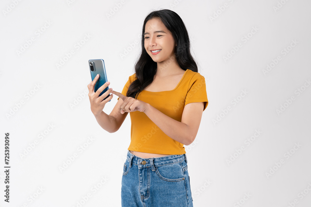 Beautiful Asian woman holding smartphone and smiling on white background. Beautiful Asian woman holding smartphone and smiling on white background.