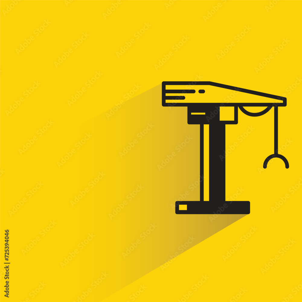 construction crane icon with shadow on yellow background