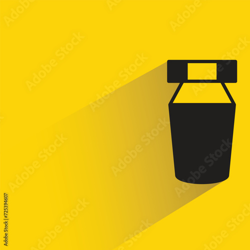 glue bottle icon with shadow on yellow background