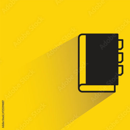 book icon with shadow on yellow background