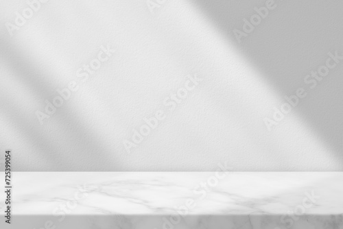 Marble Table with White Stucco Wall Texture Background with Light Beam and Shadow, Suitable for Product Presentation Backdrop, Display, and Mock up. © mesamong