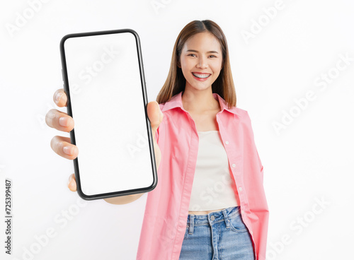 Beautiful Asian woman holding smartphone mockup of blank screen on white background.