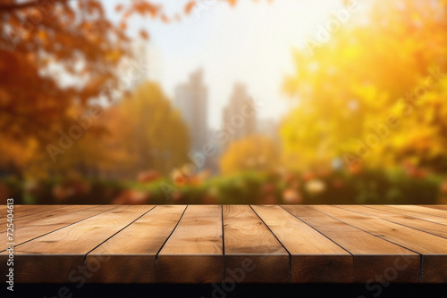 Empty blank wooden table fall background with autumn trees orange yellow color leaves backdrop forest or park nature scene abstract blurred bokeh tabletop for product display desk mockup. Copy space .
