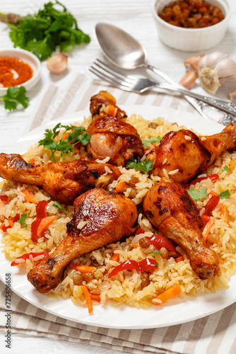 fried chicken drumsticks over rice pilaf, top view