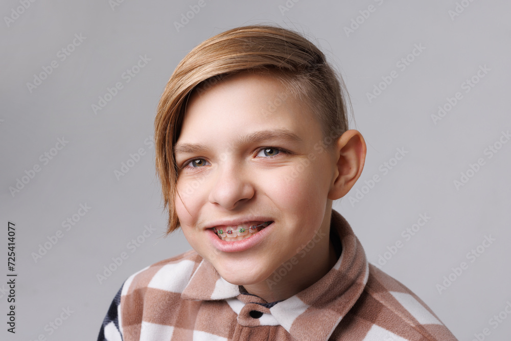 close-up portrait of a teenager with braces, the boy is happy with braces close-up portrait of a teenager with braces, the boy is happy with braces