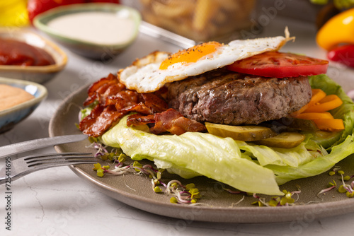 Beef burger without a bun with a fried egg