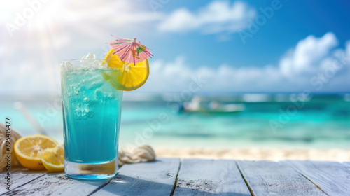 Blue hawaii cocktail on white wooden table with blue sea and sky background.