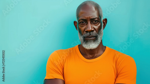 Portrait african athletic attractive serious middle aged man on a bright light blue background.