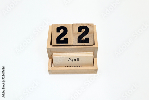 22nd of April wooden perpetual calendar. Shot close up isolated on a white background