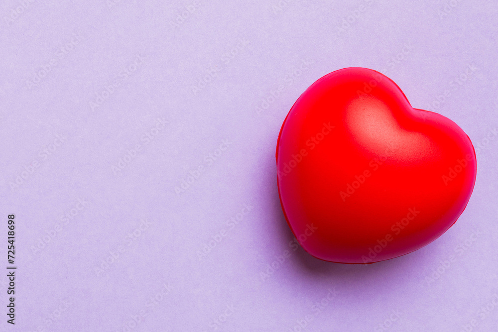 red heart shape on colored background. minimal concept top view with copy space red heart shape on colored background. minimal concept top view with copy space