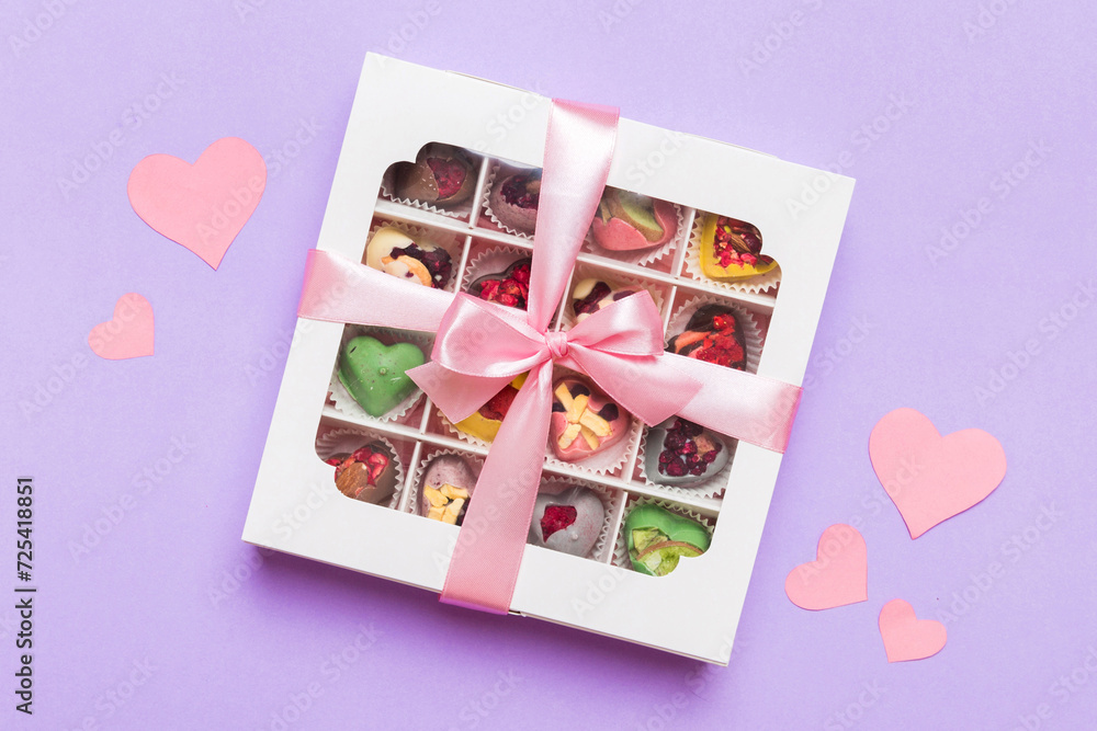 Valentine day composition: sweet candy, with gift boxes with bow and red felt hearts, photo template, background. Top View with copy space Valentine day composition: sweet candy, with gift boxes with bow and red felt hearts, photo template, background. Top View with copy space