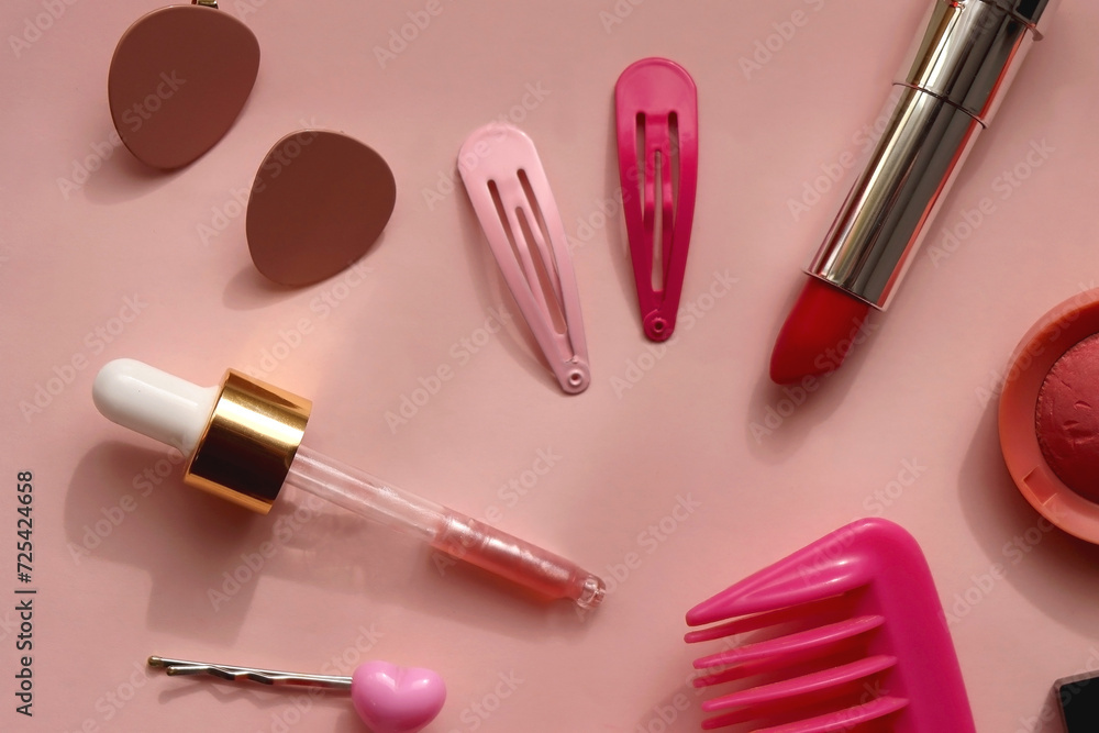 Various pink accessories and make up products on bright pink background. Flat lay. Various pink accessories and make up products on bright pink background. Flat lay.
