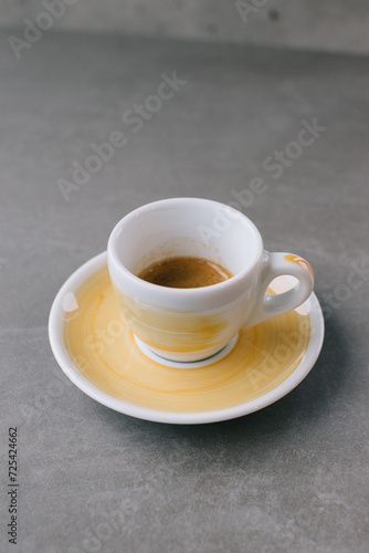 Close up of a cup of espresso or dopio on a gray stone background. photo