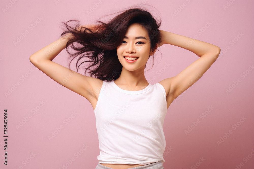 Young happy smiling Asian woman model wearing tshirt looking at camera on color background. Face skin hair care korean cosmetic and makeup, fashion ads. Beauty portrait. White t-shirt mock up template Young happy smiling Asian woman model wearing tshirt looking at camera on color background. Face skin hair care korean cosmetic and makeup, fashion ads. Beauty portrait. White t-shirt mock up template